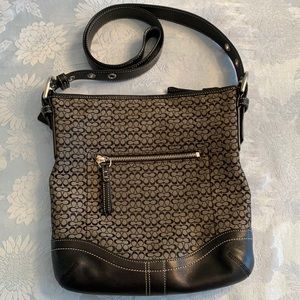 Coach black crossbody with CC monogram design.
